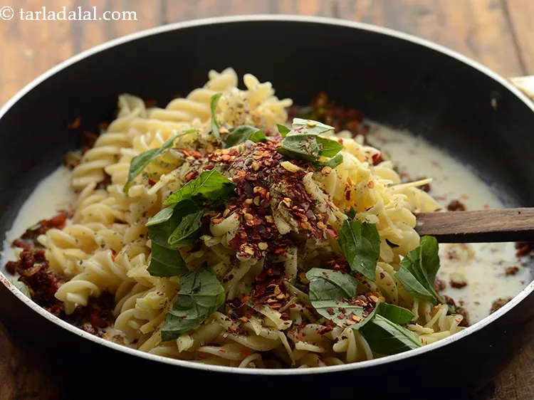 Step 29 – Add chilli flakes. The quantity can be adjusted as per your liking.