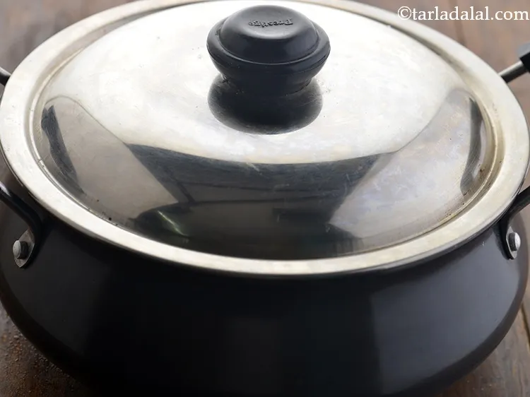 Step 3 – Cover the pan with a lid to make the water boil faster.