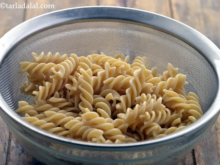 Step 8 – Immediately drain the cooked pasta into a sieve or colander.