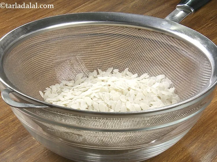 Step 4 – To make nutritious <strong>baked poha</strong>, clean and place the beaten rice or jada poha in …