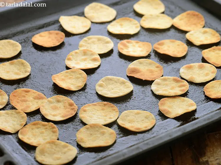 Step 15 – Bake the <strong>papadis</strong> in a pre-heated oven at 200&deg;C (400&deg;F) for 10 minutes, turning them …