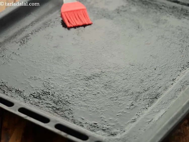 Step 13 – Grease the baking tray with oil. Alternatively, you can also line the tray with parchment …