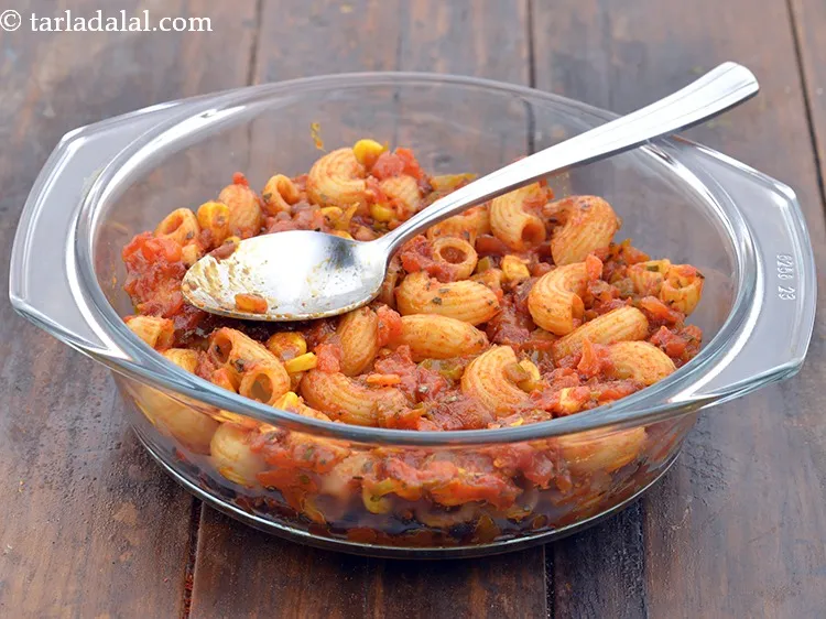 Step 62 – Put the macaroni and spread it evenly using the back of a spoon.