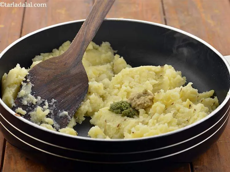 Step 16 – Add the ginger-green chilli paste, salt.