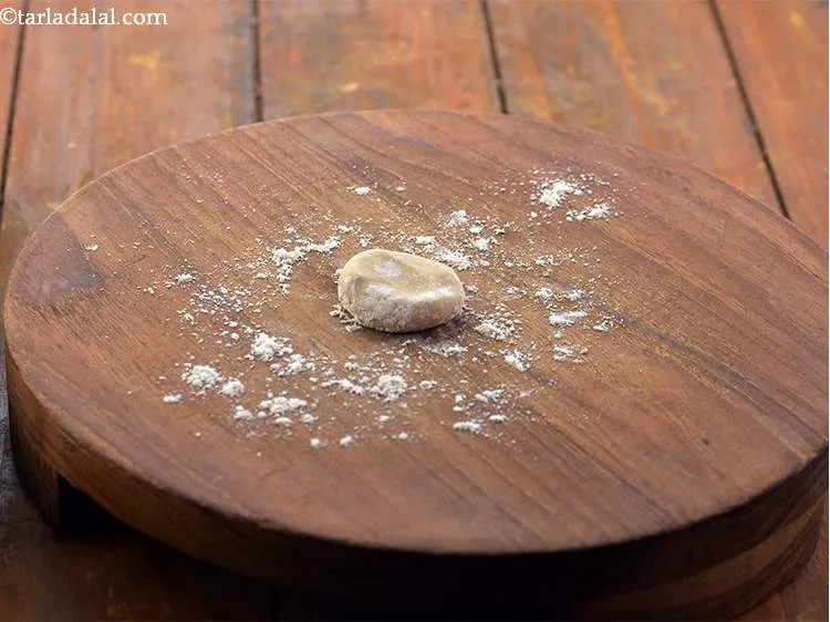 Step 10 – Roll the portion into round balls and flatten them between your palms.