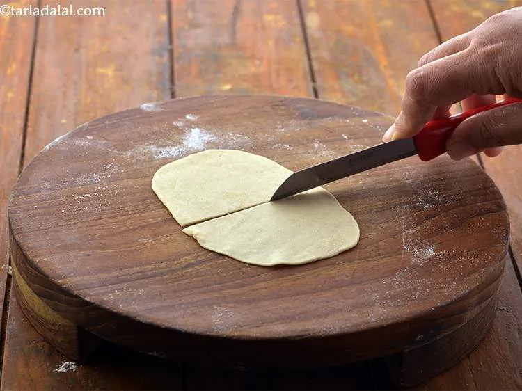 Step 24 – Divide each chapatti into 2 halves using a sharp knife.