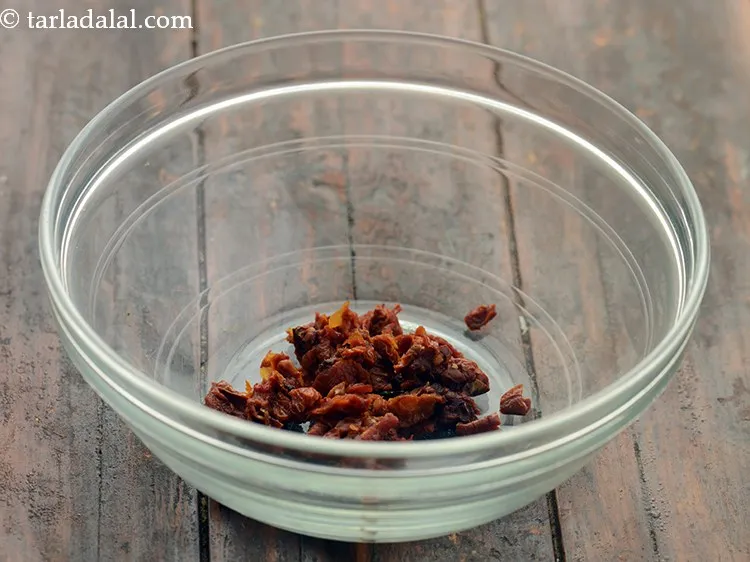 Step 3 – After half an hour, drain and finely chop them. If you are using sun-dried tomatoes …