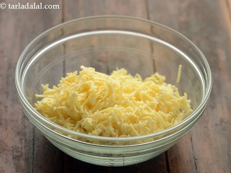 Step 6 – Add grated processed cheese. Any variety of cheese like parmesan, mozzarella, smoked Gouda cheese, cheddar, …