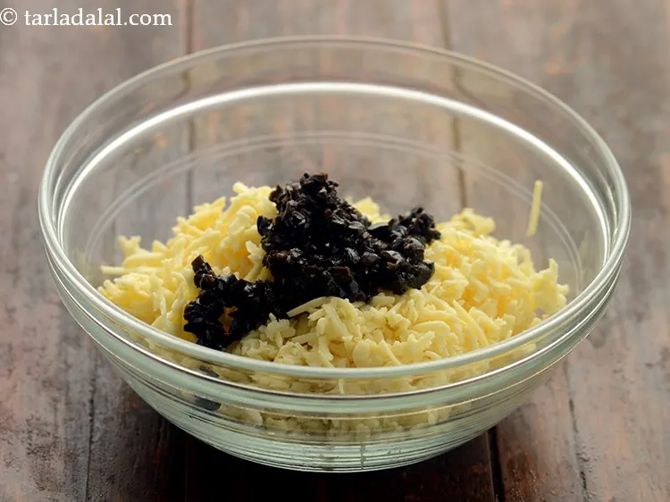 Step 7 – Add finely chopped black olives. They give a mild salty flavour to the sun-dried tomato …