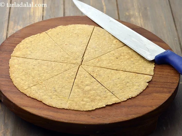 Step 17 – Place it on a clean dry surface and cut into 8 equal triangles using a …