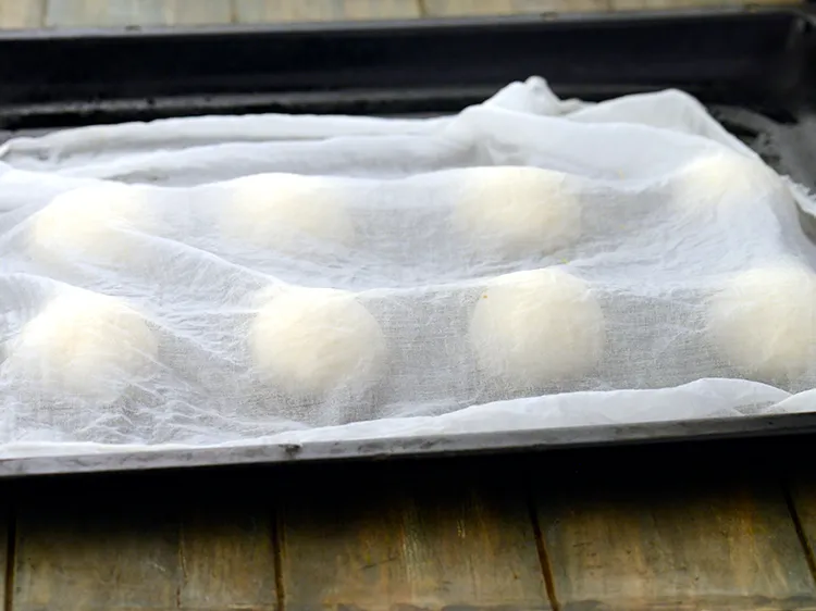 Step 47 – Cover them with a damp muslin cloth and keep aside in a warm place for …