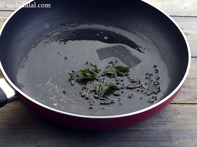 Step 25 – Add 4&nbsp;<a href="https://www.tarladalal.com/glossary-curry-leaves-kadi-patta-kadipatta-388i">curry leaves (kadi patta)</a>.