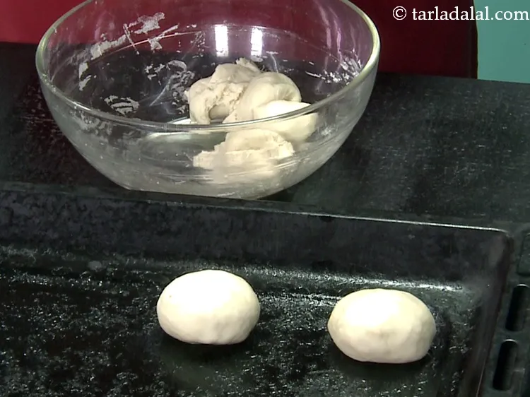 Step 45 – Transfer it into a greased baking tray. Ensure that there is enough space between the …