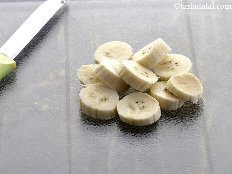 Step 4 – Place the banana on a clean chopping board and remove the 2 ends of the …