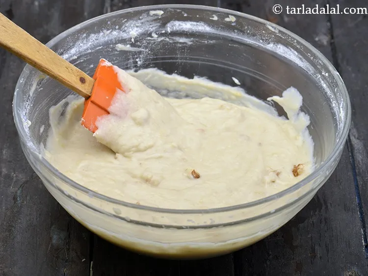 Step 34 – Mix well using a spatula. The <strong>batter of banana and walnut bread recipe | Eggless …