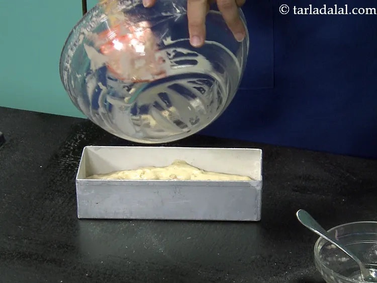 Step 39 – Pour the prepared cake batter into this greased and dusted tin.