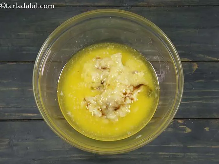 Step 11 – Add the vanilla essence. It enhances all the other flavors in the eggless loaf recipe.