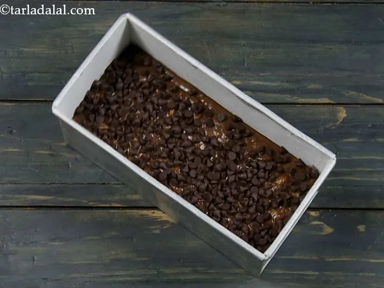 Step 20 – Sprinkle the chocolate chips evenly over it. You can also sprinkle some chopped walnuts if …