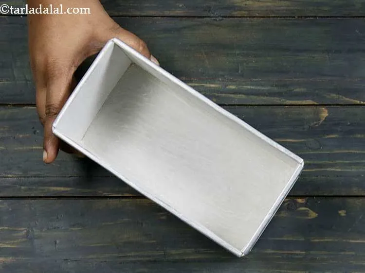 Step 2 – Grease a 150 mm. (6") x 87 mm. (3? ") loaf tin with butter and …