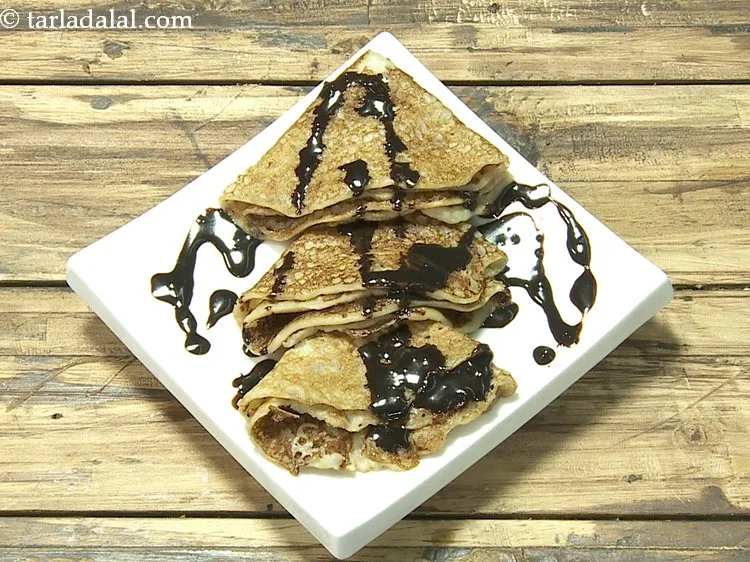 Step 17 – Pour little chocolate sauce over each pancake. Alternatively, you can drizzle honey or maple syrup.