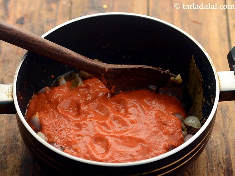 Step 19 – Add the tomatoes- cashew mixture.