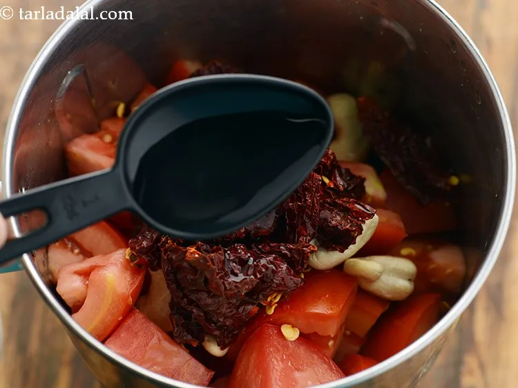 Step 5 – Add 2 tbsp of water in a mixer.