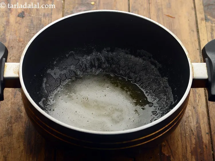 Step 7 – To cook the Kolhapuri paste, heat the oil and butter in a deep non-stick pan. …