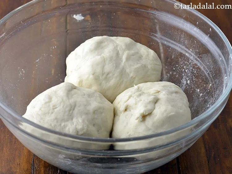 Step 19 – Divide the dough of homemade pizza dough into 3 equal portions.