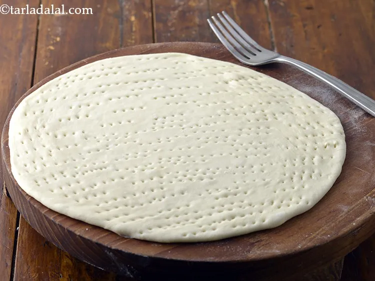 Step 47 – Prick the circle evenly using a fork so that it doesn&rsquo;t puff up.