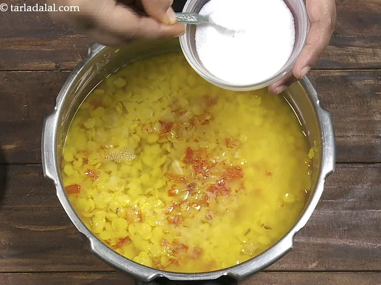 Step 12 – Add 1 cup of water to adjust the consistency of <strong>toovar dal</strong> and salt.