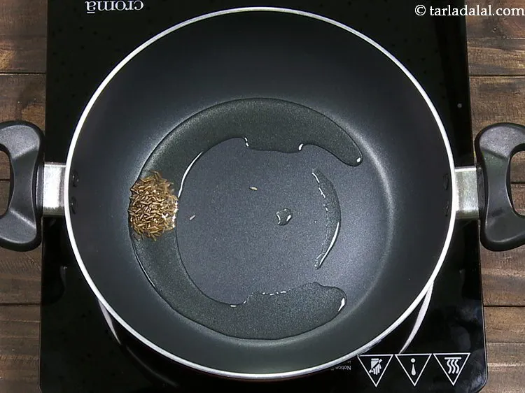 Step 15 – Once the oil is hot, add cumin seeds.