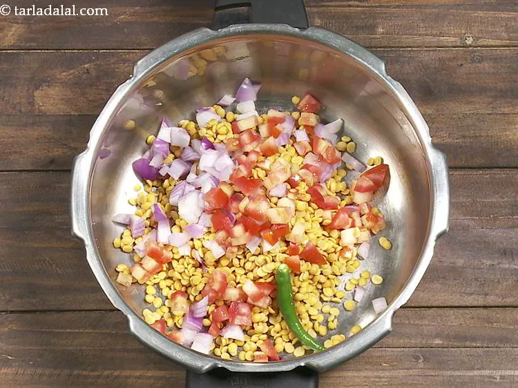 Step 8 – Add green chili. If you love the garlicky flavor in your dal then add some …