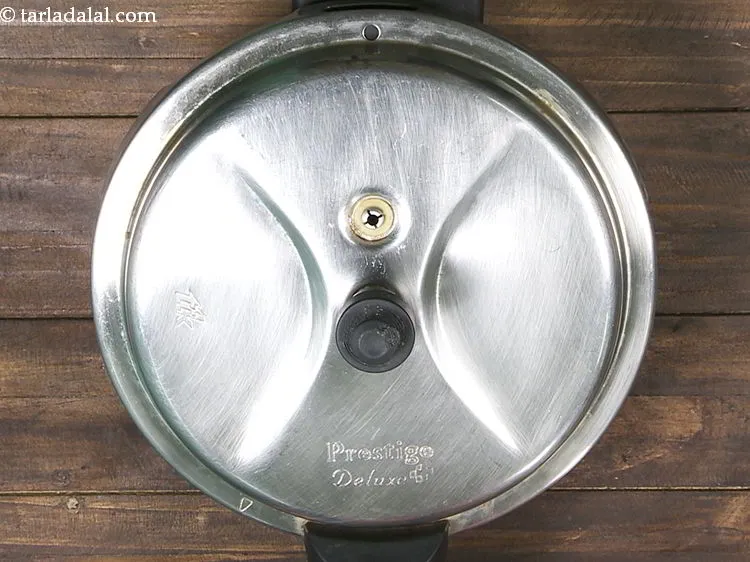 Step 10 – Mix well and pressure cook for 3 whistles. Allow the steam to escape before opening …