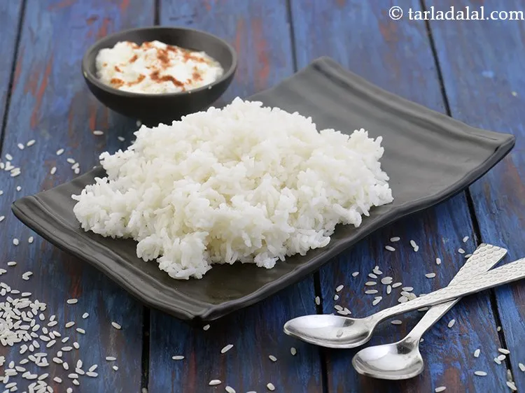 Step 54 – Another interesting Maharashtrian combination is to mix&nbsp;batata tomato rassa bhaji with <a href="https://www.tarladalal.com/how-to-make-rice-in-a-pressure-cooker-white-rice-42223r">rice</a>.