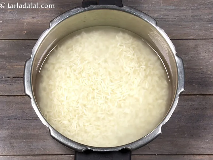 Step 6 – Add salt, 1&frac12; cups of water and mix well. The amount of water while making …