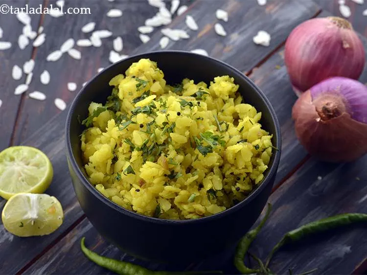 Step 17 – Serve the <strong>aloo poha </strong>hot garnished with coriander and lemon wedge.