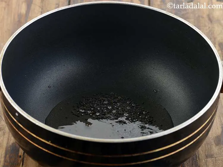 Step 1 – For the <strong>quick kanda batata poha</strong> <strong>recipe</strong>, heat the oil in a deep non-stick pan …