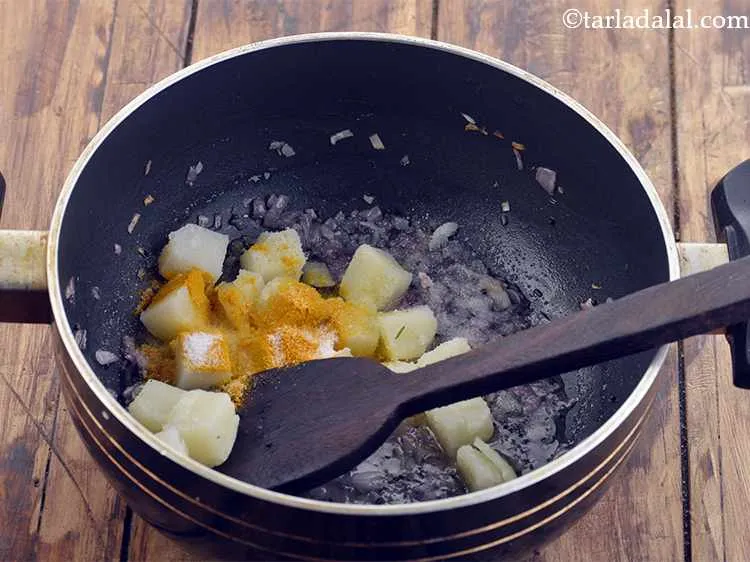 Step 6 – Add salt and&nbsp; &frac12; tsp of turmeric powder.