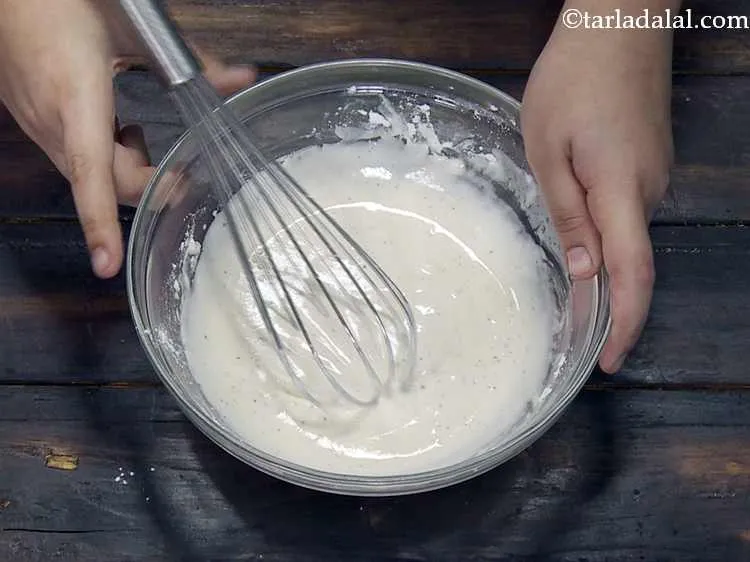 Step 10 – Using ? cup of water, whisk everything well to make a thick batter. The batter …