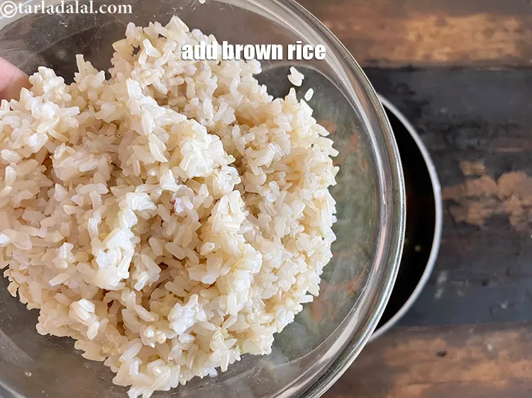 Step 20 – Add 2 cups&nbsp;<a href="https://www.tarladalal.com/glossary-soaked-and-cooked-brown-rice-1908i">cooked brown rice</a>, see above.