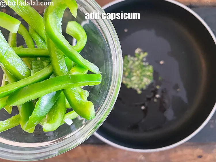 Step 12 – Add 1/2 cup&nbsp;thinly&nbsp;<a href="https://www.tarladalal.com/glossary-sliced-capsicum-165i">sliced capsicum</a>.