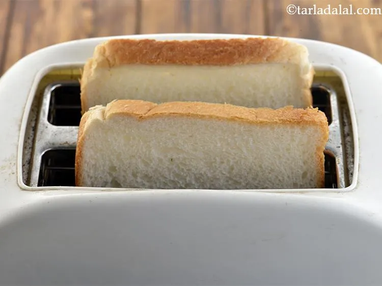 Step 17 – To make&nbsp;<strong>beans on toast recipe | Indian style baked beans on toast |&nbsp;</strong>put 2 bread …