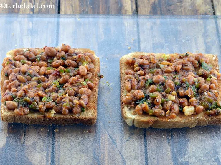 Step 21 – Spread a portion of the baked beans mixture on the toasted bread slices.