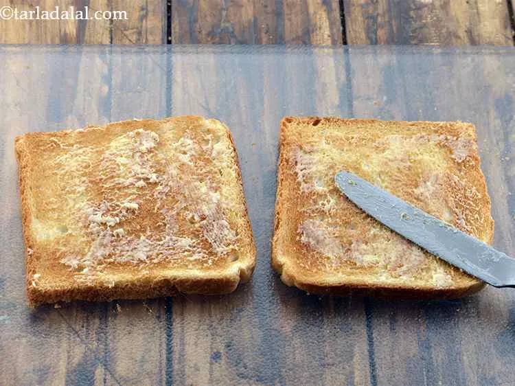 Step 20 – Spead about&nbsp;&frac12;&nbsp; tsp of butter evenly on each slice. Keep the buttered side facing upwards.