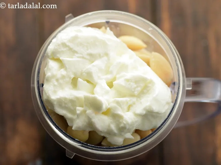 Step 5 – Add hung curd. It will give in a nice thick texture to our beetroot hummus.&nbsp;