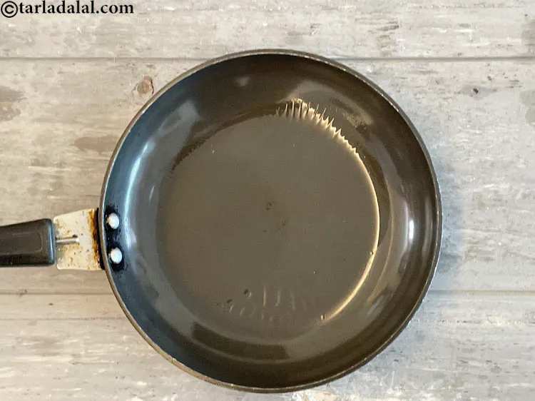 Step 26 – For the tempering, heat the oil in a small pan.