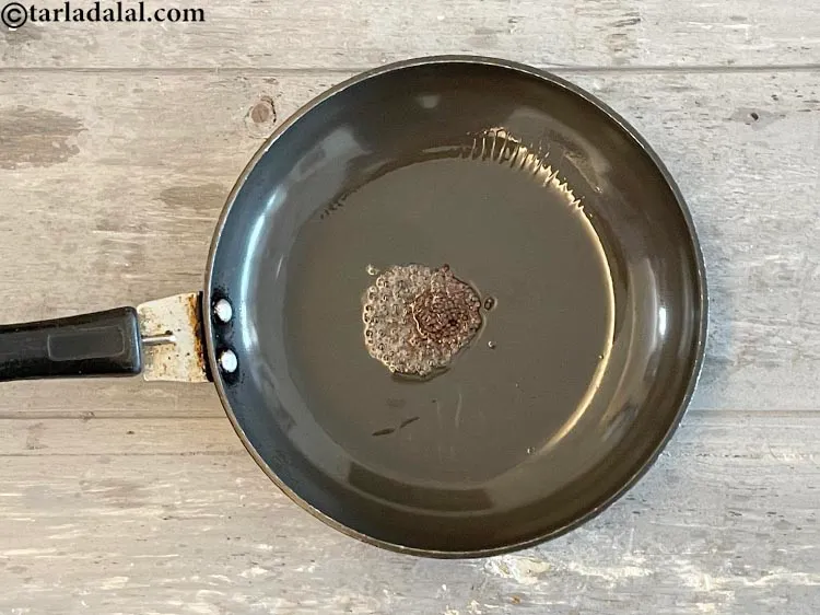 Step 27 – <meta charset="UTF-8" />Add 1/4 tsp&nbsp;<a href="glossary-mustard-seeds-sarson-rai-sarson-ke-beej-525i">mustard seeds ( rai / sarson)</a>.