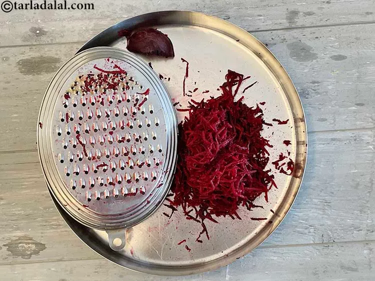Step 10 – Hold the thick/ thin end of the grater in one hand and the beetroot in …