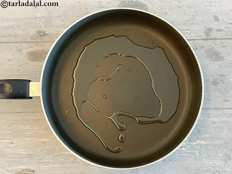 Step 11 – <meta charset="UTF-8" />To make&nbsp;beetroot chutney, heat the oil in a broad non-stick pan.