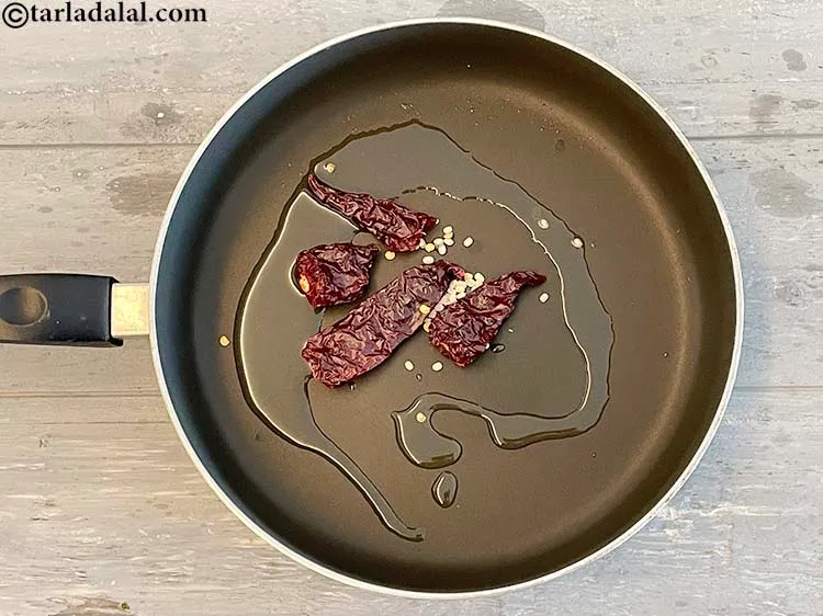 Step 13 – Add&nbsp;<meta charset="UTF-8" />3&nbsp;<a href="glossary-whole-dry-kashmiri-red-chillies-kashmiri-mirch-kashmiri-lal-mirch-332i">whole dry kashmiri red chillies</a>.